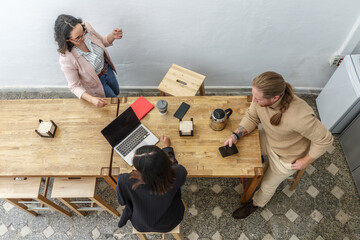 Coworking group discussing in casual office setting