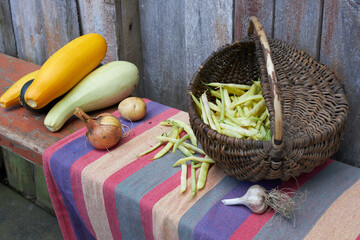 Autumn harvest, vegetables and fruits lie on a wooden table.