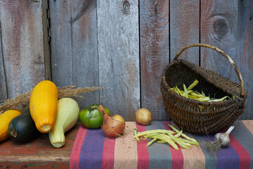 Autumn harvest, vegetables and fruits lie on a wooden table.