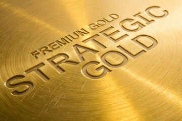 Premium gold background strategic forward focus metallic texture engraved text brushed metal golden surface luxury abstract design with warm glow and depth, elegant mood