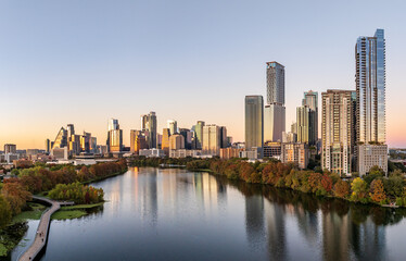 Aerial panoramic skyline of Austin Texas from the east at dusk or sunset in December 2025 with fall colors and clear sky