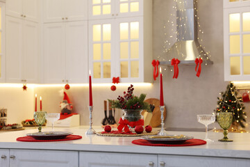 Christmas decor and tableware on countertop in kitchen. Interior design