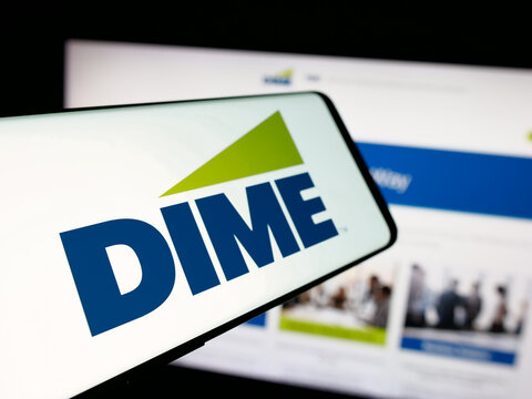 Stuttgart, Germany - 12-05-2025: Smartphone with logo of US financial company Dime Community Bank on screen in front of website. Focus on center-left of phone display.
