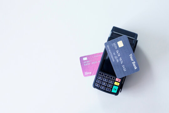 Contactless payment. Credit card on payment terminal over office desk. Money transfer concept	
