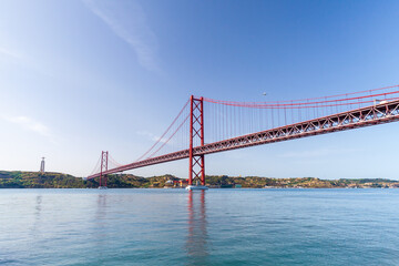 25 de Abril Bridge, a red suspension bridge similar to Golden Gate in San Francisco