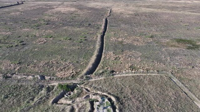 Panoramic aerial drone view of military trenches and defense lines in the empty fields of Karabakh, Azerbaijan