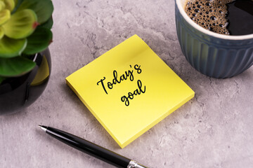 Today's goal text on yellow sticky note