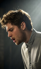 A portrait of a confident and handsome young businessman with a beard wearing a suit and shirt, posing with a serious expression in a studio as a fashion model