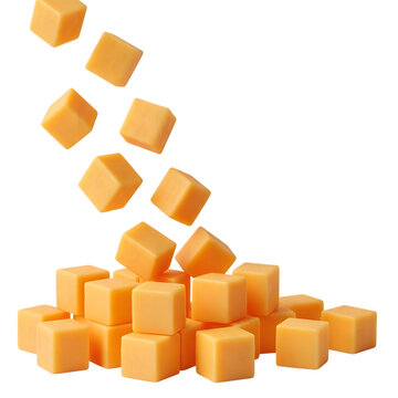 Cheddar cheese cubes falling on pile isolated on a transparent background