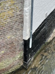 A metal drain pipe