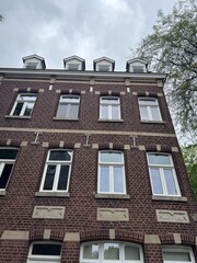 The side of a brick building viewed from the street