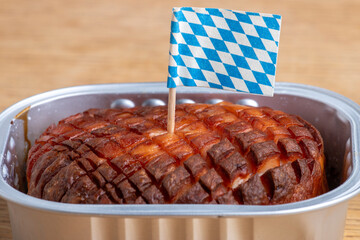 baked bavarian leberkaese on light wood