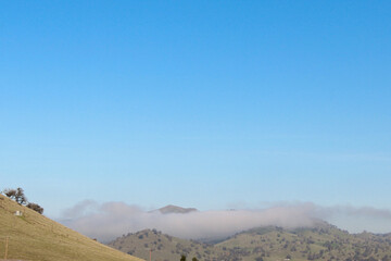 Fototapeta premium Morning fog covering the mountains