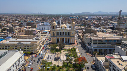 Chiclayo’s Main Square featuring the iconic Cathedral, central fountain, green gardens, and a...
