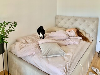 young woman sleeping on bed
