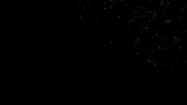 Red Confetti Explosion on Black Background scattered