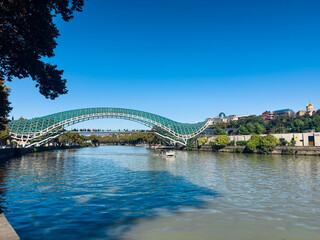 Modern Bridge of Peace Over Kura River in Tbilisi Georgia © EwaStudio