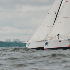 bow of a sailing boats with bowsprit at sailing regatta in the Gulf of Finland at sunny day,...