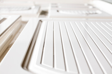 Stretching vinyl film onto MDF panel parts for furniture manufacturing and assembly in an industrial workshop using a CNC machine