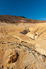 Kr&yacute;suv&iacute;k is a vibrant geothermal area on Iceland's Reykjanes Peninsula, famous for its colorful, mineral-stained hills, bubbling mud pots, steaming fumaroles (steam vents), and hot springs.