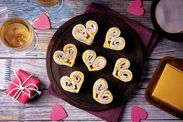 Ham Cheddar cheese cream cheese pinwheel in the form of hearts in a plate