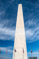 Obraz premium Iconic Washington DC obelisk stretches upward under dynamic cloud-filled sky