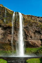 Seljalandsfoss is a famous 60-meter-high waterfall in South Iceland.