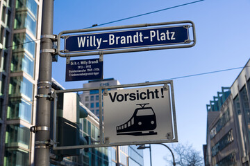 Obraz premium Willy Brand Square street name sign at downtown of German city of Frankfurt on a sunny autumn day. Photo taken November 22nd, 2025, Frankfurt am Main, Germany.