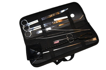 A collection of scissors and various tools stored in a portable case, ideal for DIY projects or crafting