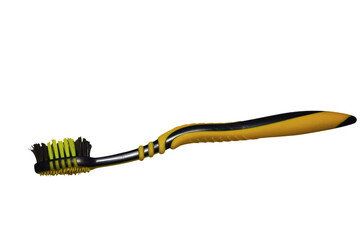 A bright yellow and black toothbrush placed on a clean white background