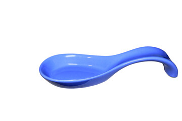 A blue spoon placed on a clean white surface, ready for use