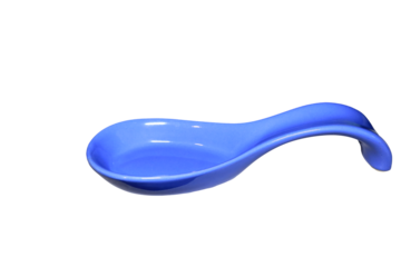 A blue spoon placed on a clean white surface, ready for use