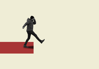 Obraz premium The man covering his eyes with his hand and takes step on edge of abyss.