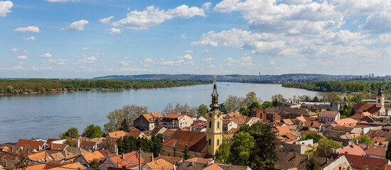 City with a river running through it and a tall tower in the middle