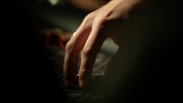 Close up cinematic video of poker player hand carefully placing and sliding betting chips across patterned felt casino table during live gambling round