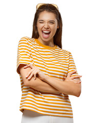 Emotional young woman winking and laughing with crossed arms, wearing yellow shirt