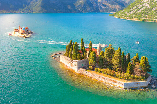 Saint George Island and Church of Our Lady of the Rocks in Perast, Montenegro. Our Lady of the Rock island and Church in Perast on shore of Boka Kotor bay (Boka Kotorska), Montenegro, Europe. 