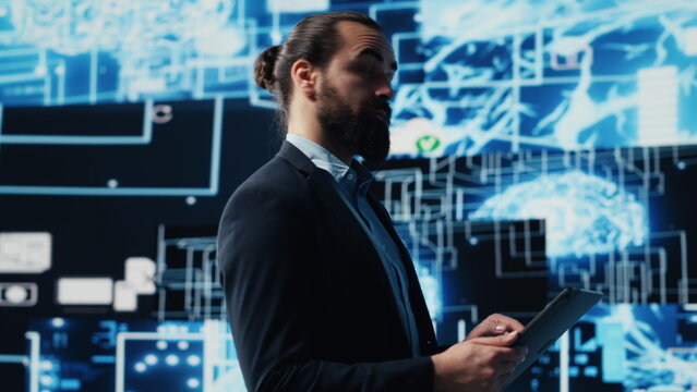 Entrepreneur uses laptop to review artificial intelligence brain system on dashboard, using high tech data visualization for coding, analytics and deep learning. Strategic growth. Camera A. - Powered by Adobe