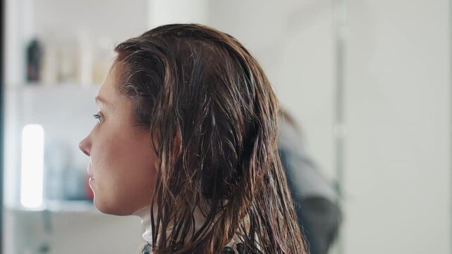 mirror with wet hair visible, reflection showing hair that is moist, mirror capturing image of damp and unstyled hair, reflection in mirror displaying hair that is wet and uncombed