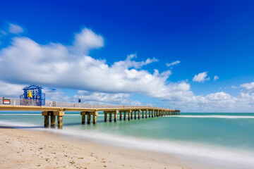 Sunny Isles Beach Miami fishing pier. Long exposure motion blur