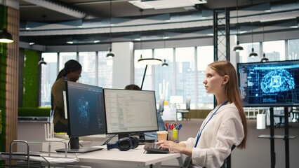 Female engineer using AI LLM chatbot, optimizing company systems performance. System administrator...