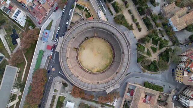 Breathtaking Aerial View of an Impressive Ancient Amphitheater in a Bustling City