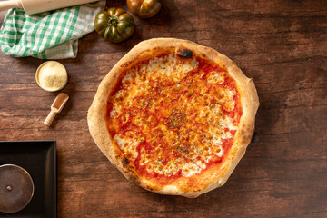 Homemade margherita pizza on wooden table