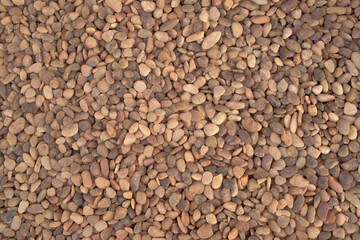 Fundo com pedrinhas arredondas de jardim ornamental visto de cima, textura de rochas