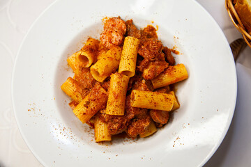 Italian food rigatoni pomodoro close up overview