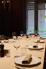 bright daytime dining scene featuring sophisticated table decoration and professional service