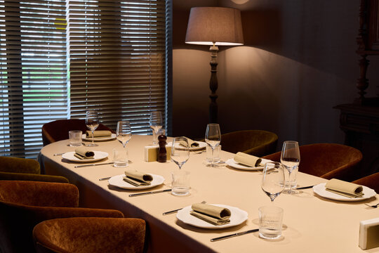 exquisite evening event featuring meticulously arranged tableware and ambient lighting for wine appreciation