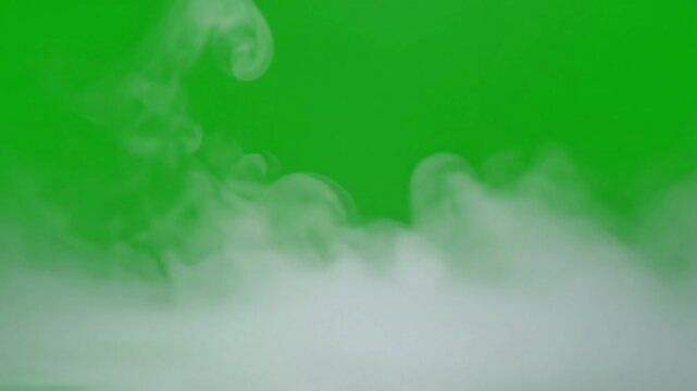 Foggy mountain peaks emerging from cloudscape with thin layer of ground fog effect green screen fog layer subtle style featuring fog,