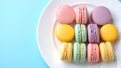 Obraz premium Colorful macarons presenting an assortment of sweet french pastries on a white plate, featuring various pastel hues and inviting textures on a contrasting background