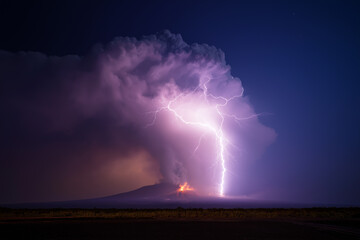 Dramatic nighttime lightning strike over smoldering volcano